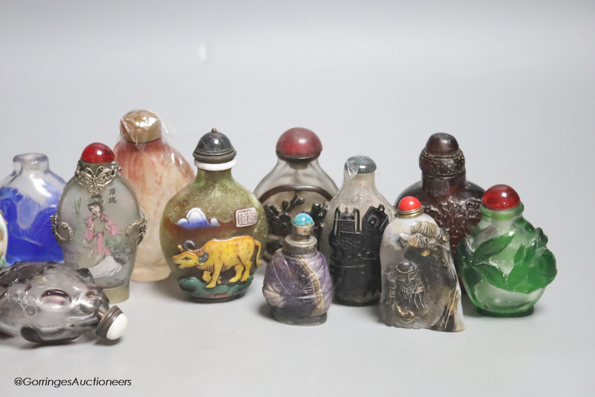 Fifteen Chinese glass overlay snuff bottles
